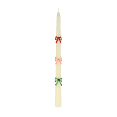 Multi color bow taper candle